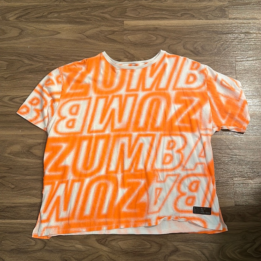 Zumba orange shirt.